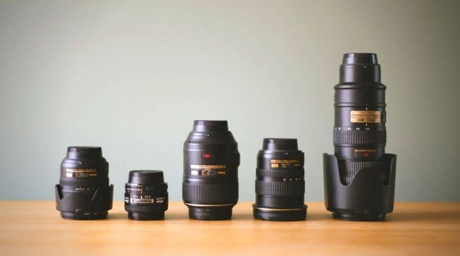 bunch of camera lenses placed on a table
